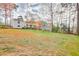 Spacious backyard with wooden deck and lush lawn, ideal for relaxation and recreation at 3265 Newcastle Way, Snellville, GA 30039