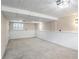 Spacious basement with gray carpet, white brick detail and recessed lighting at 3265 Newcastle Way, Snellville, GA 30039