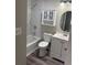 Modern bathroom featuring a vanity with storage, oval mirror and shower-tub combination at 3265 Newcastle Way, Snellville, GA 30039