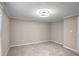 A simple bedroom with beige walls and carpet and white trim and ceiling fan at 3265 Newcastle Way, Snellville, GA 30039