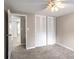 Bedroom with closet, open doorway, carpet, and ceiling fan at 3265 Newcastle Way, Snellville, GA 30039