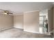 Inviting living room featuring neutral walls, carpet floors, and view into an adjacent kitchen at 3265 Newcastle Way, Snellville, GA 30039