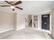 Inviting living room with neutral walls, carpet floors, and staircase entrance to the upper level at 3265 Newcastle Way, Snellville, GA 30039