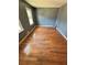 Bedroom featuring hardwood floors, neutral walls and two windows at 4034 Weeks Nw Dr, Kennesaw, GA 30144