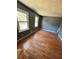 Bedroom featuring hardwood floors, neutral walls and two windows at 4034 Weeks Nw Dr, Kennesaw, GA 30144