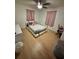 Neutral bedroom with a ceiling fan and light wood floors and a platform bed at 4034 Weeks Nw Dr, Kennesaw, GA 30144
