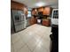Kitchen featuring stainless steel appliances and warm wood cabinets at 4034 Weeks Nw Dr, Kennesaw, GA 30144