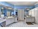 Bright bathroom featuring a tile floor, double vanity sinks and framed mirrors at 6000 E Andechs Smt, Johns Creek, GA 30097