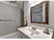 Bathroom featuring vanity with sink, framed mirror, and grey paint at 6000 E Andechs Smt, Johns Creek, GA 30097