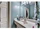 Bathroom featuring a white vanity with sink and a large mirror at 6000 E Andechs Smt, Johns Creek, GA 30097