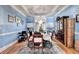 Charming dining room with hardwood floors, a chandelier, and ample space for entertaining guests at 6000 E Andechs Smt, Johns Creek, GA 30097