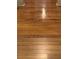 Close-up of recently refinished hardwood flooring at 6000 E Andechs Smt, Johns Creek, GA 30097