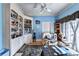 Cozy living room with built-in bookshelves, hardwood floors, and a leather recliner at 6000 E Andechs Smt, Johns Creek, GA 30097