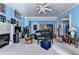 Open-concept living room featuring a fireplace, built-ins, and ample seating providing a relaxing atmosphere at 6000 E Andechs Smt, Johns Creek, GA 30097