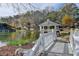 Picturesque view of a gazebo on an island, accessed via a small bridge, on the community pond at 6000 E Andechs Smt, Johns Creek, GA 30097