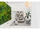 Bright lobby features a living wall, modern lighting, and stylish seating at 775 Juniper Ne St # 334, Atlanta, GA 30308