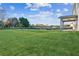 Large backyard offers scenic views, complemented by a covered patio connected to the home at 2759 Porches Ln, Dacula, GA 30019