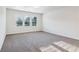 Large carpeted bedroom has neutral walls and three windows letting in ample natural light at 2759 Porches Ln, Dacula, GA 30019