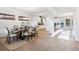 Open dining room view with hardwood floors, white wainscotting, and access to the kitchen at 2759 Porches Ln, Dacula, GA 30019