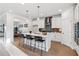 Modern kitchen featuring white cabinets, a center island with barstools, and stainless steel appliances at 2759 Porches Ln, Dacula, GA 30019
