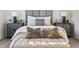 Close up of main bedroom area showing upholstered bed, bench, and decorative side tables at 2759 Porches Ln, Dacula, GA 30019