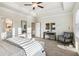 This is a bright main bedroom with seating area and ensuite bath at 2759 Porches Ln, Dacula, GA 30019
