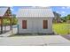 Pool house with white wood paneling, white door, and brown shutters at 2759 Porches Ln, Dacula, GA 30019