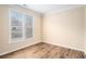 Bright bedroom with wood floors and ample natural light at 5053 Kingsbridge Pass, Powder Springs, GA 30127