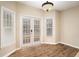 Charming breakfast nook featuring white french doors and windows at 5053 Kingsbridge Pass, Powder Springs, GA 30127
