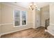 Elegant dining room with wood floors and a chandelier at 5053 Kingsbridge Pass, Powder Springs, GA 30127