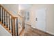 Inviting foyer with hardwood floors and staircase at 5053 Kingsbridge Pass, Powder Springs, GA 30127