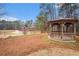 Charming community gazebo with a view of the pond and water feature, surrounded by trees at 5053 Kingsbridge Pass, Powder Springs, GA 30127