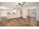 Open-concept living room and kitchen with wood floors and natural light at 5053 Kingsbridge Pass, Powder Springs, GA 30127