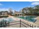 Community pool with large pool house, covered in the off season, set in a green, wooded area at 5053 Kingsbridge Pass, Powder Springs, GA 30127