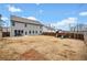 Spacious fenced-in backyard with a patio, green grass, a playset and plenty of space to enjoy at 614 Edgemore Rd, Canton, GA 30114