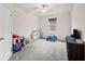 Neutral bedroom with carpeted floors, a window, and a ceiling fan at 614 Edgemore Rd, Canton, GA 30114