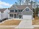 Charming two-story home with blue shutters and a well-manicured front yard at 614 Edgemore Rd, Canton, GA 30114