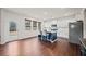 Bright kitchen with white cabinets, stainless steel appliances, and a blue island with seating at 614 Edgemore Rd, Canton, GA 30114