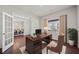 Cozy home office with a large desk, neutral walls, hardwood floors, and natural lighting at 614 Edgemore Rd, Canton, GA 30114