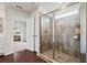 Bathroom showcasing a glass-enclosed shower with elegant tile work and neutral walls at 614 Edgemore Rd, Canton, GA 30114