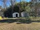 The expansive backyard features storage sheds and an area for recreation and play at 2408 Three Bars Dr, Snellville, GA 30078