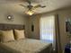 Bedroom features a comfy bed with neutral bedding, complemented by decorative mirrors at 2408 Three Bars Dr, Snellville, GA 30078