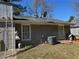 Exterior view of the home showcasing the siding, roof, and backyard landscape at 2408 Three Bars Dr, Snellville, GA 30078