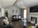 Bright living room featuring hardwood floors, fireplace and abundant seating at 2408 Three Bars Dr, Snellville, GA 30078