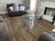 Inviting living room with hardwood floors, a stone fireplace and comfortable seating at 2408 Three Bars Dr, Snellville, GA 30078