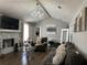 Spacious living room features a decorative chandelier, fireplace, and comfortable seating at 2408 Three Bars Dr, Snellville, GA 30078