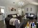 Inviting living room with vaulted ceilings, hardwood floors, and comfortable seating, perfect for relaxing at 2408 Three Bars Dr, Snellville, GA 30078