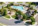 Aerial view showcasing community pool, playground, lush greenery, and well-maintained surroundings at 5315 Austrian Pine Ct, Cumming, GA 30040