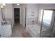 Bright bathroom with a soaking tub, tiled floors, a tiled shower, and great lighting at 5315 Austrian Pine Ct, Cumming, GA 30040