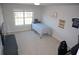 Well-lit bedroom with carpet features a large window and neutral color scheme at 5315 Austrian Pine Ct, Cumming, GA 30040